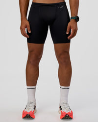 Man wearing BaseTech 8" Shorts - Black | Model:George | Size:M