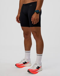 Man wearing BaseTech 8" Shorts - Black | Model:George | Size:M