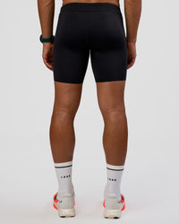Man wearing BaseTech 8" Shorts - Black | Model:George | Size:M
