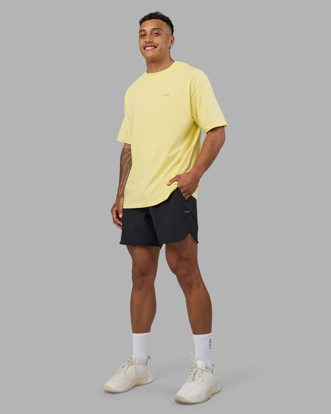 Man wearing Bold  Brave and Kind FLXCotton Oversized Tee - Lemon Fizz | Model:Daarian | Size:M