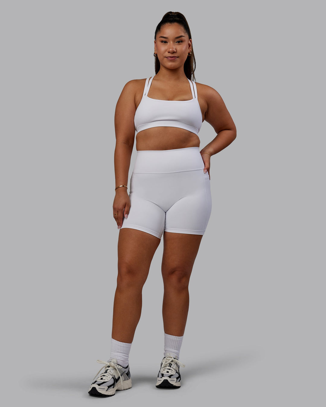 Woman wearing Bree Masters Fusion Mid Short Tights with Pockets - White