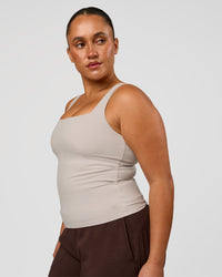 Woman wearing CF Train Hard Shelf Bra Tank - Clay | Model:Simmy | Size:M