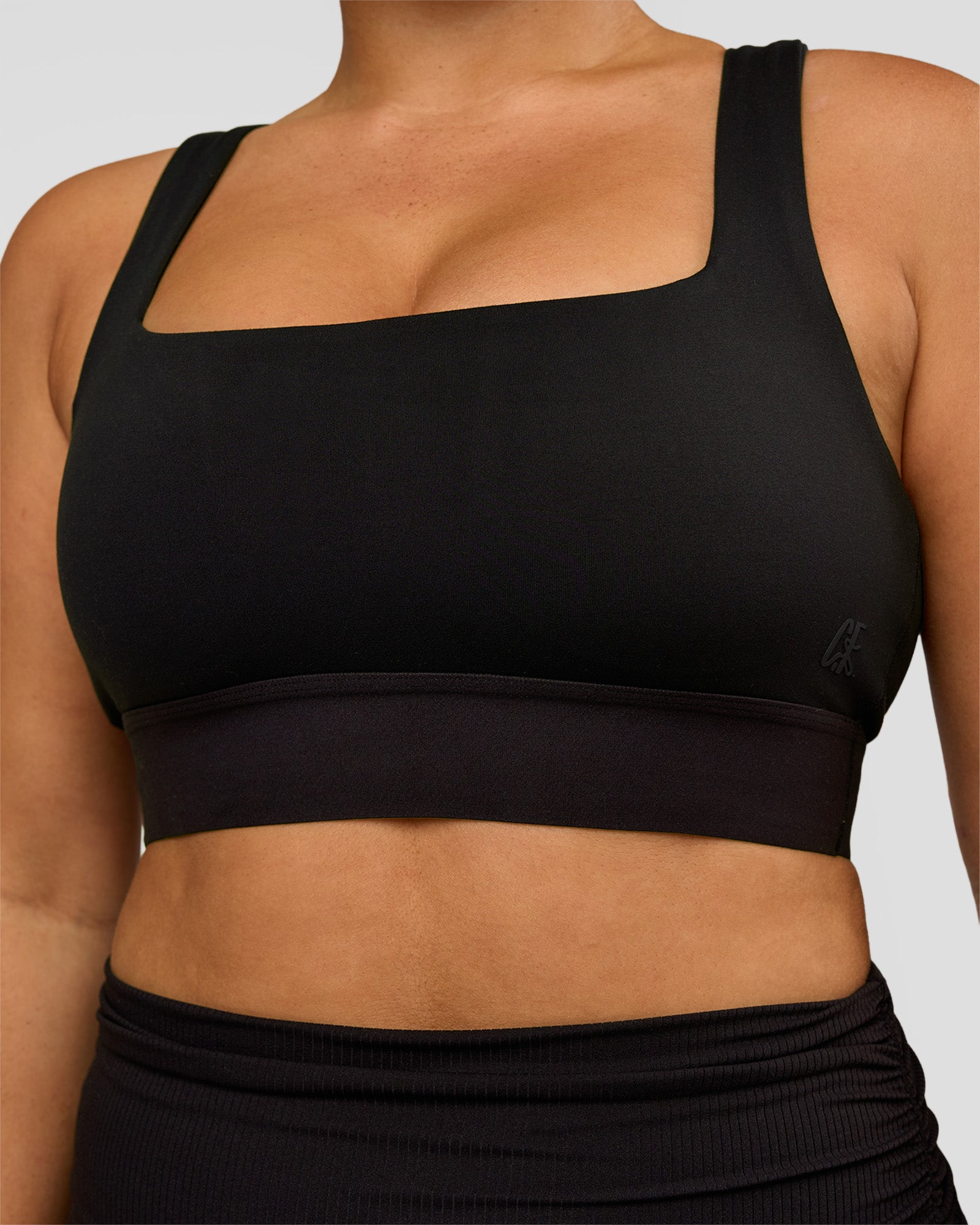 Woman wearing CF Train Hard Sports Bra - Black | Model:Simmy | Size:M