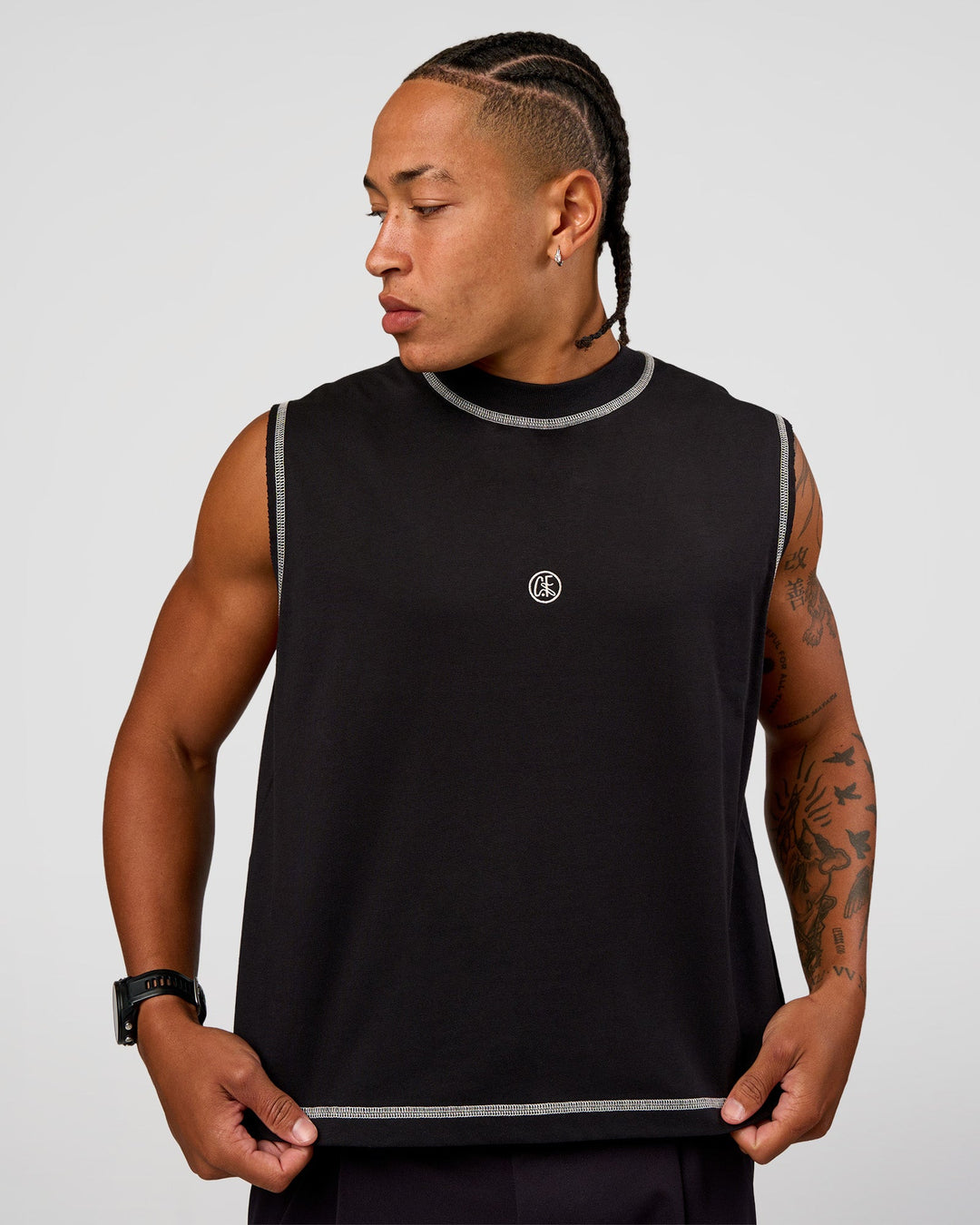 Man wearing CF Unisex Oversized Heavyweight Boxed Tank - Black-CF X LSKD Sport | Model:Malebo | Size:M