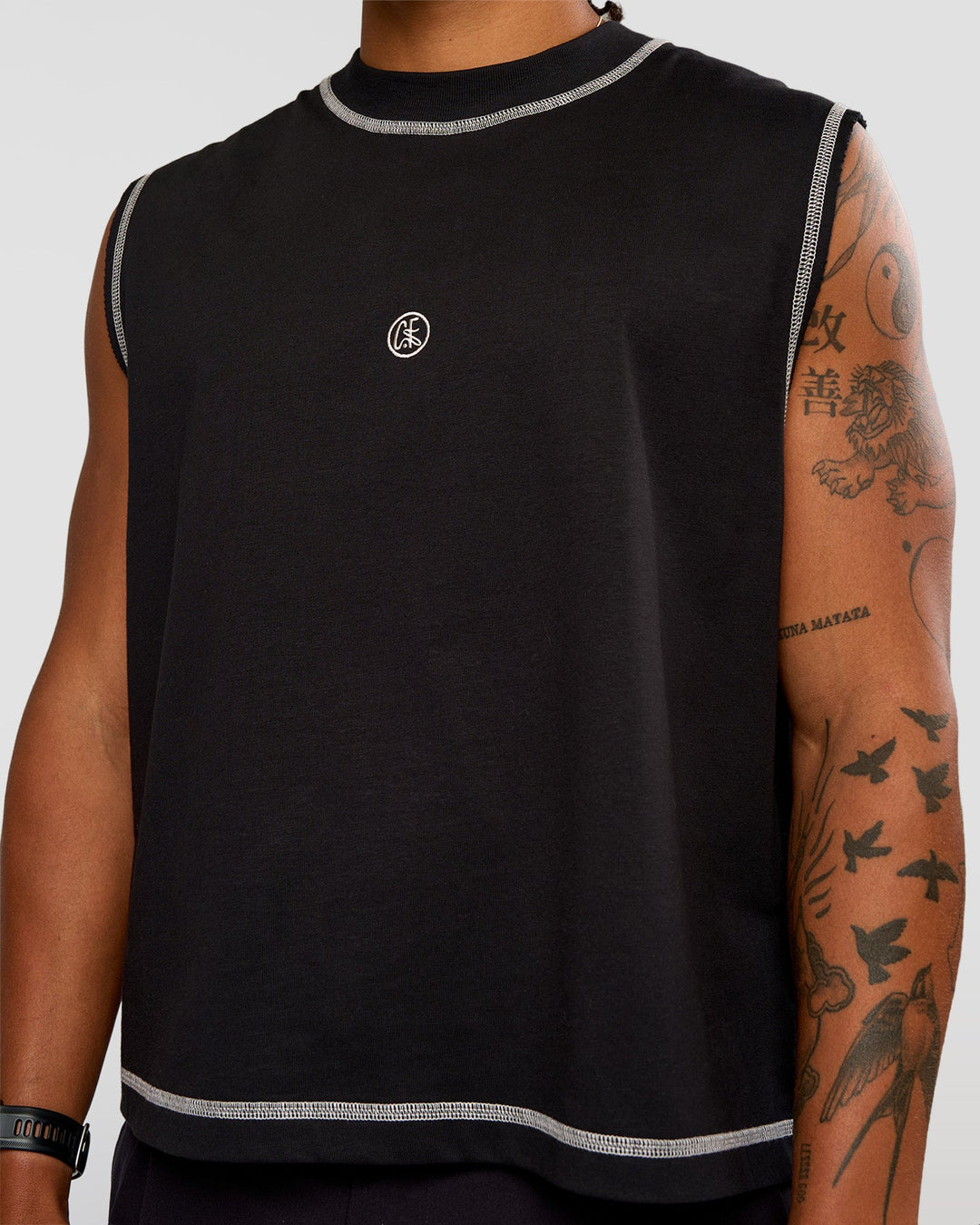 Man wearing CF Unisex Oversized Heavyweight Boxed Tank - Black-CF X LSKD Sport | Model:Malebo | Size:M