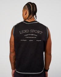 Man wearing CF Unisex Oversized Heavyweight Boxed Tank - Black-CF X LSKD Sport | Model:Malebo | Size:M