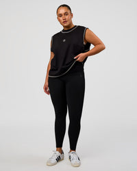 Woman wearing CF Unisex Oversized Heavyweight Boxed Tank - Black-CF X LSKD Sport | Model:Simmy | Size:M
