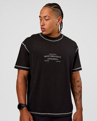 Man wearing CF Unisex Oversized Heavyweight FLXCotton Tee - Black-CF Move Through It | Model:Malebo | Size:M