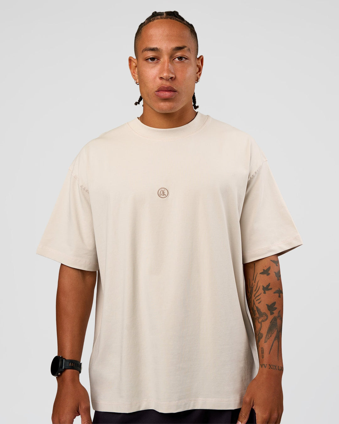 Man wearing CF Unisex Oversized Heavyweight FLXCotton Tee - Clay-CF X LSKD Sport | Model:Malebo | Size:M