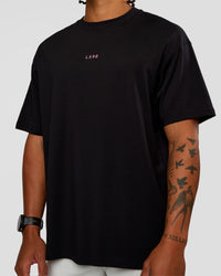 Man wearing CFT BNE 26 FLXCotton Oversized Tee in Black | Model:Malebo | Size:M | Thumbnail Index: 2
