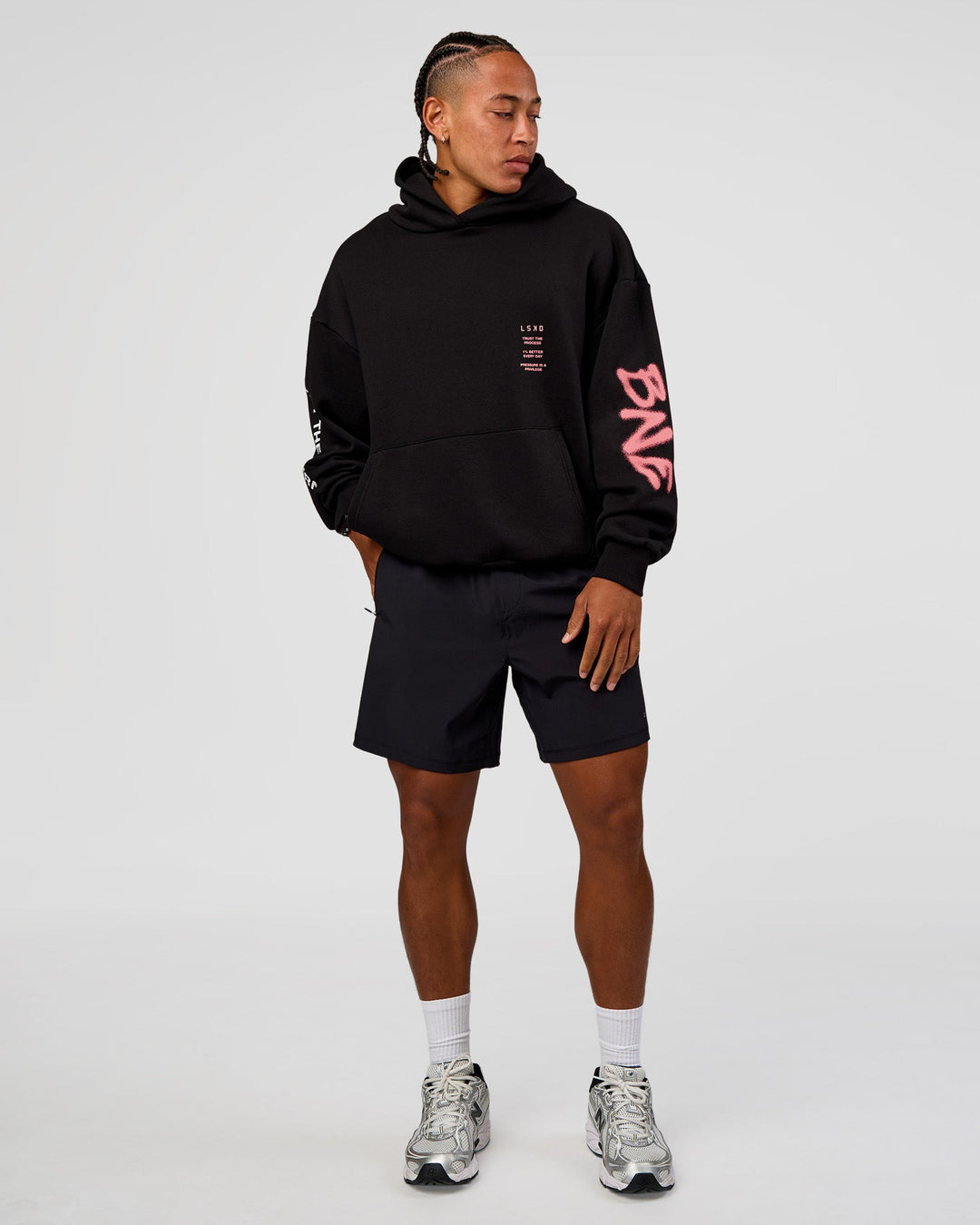 Man wearing CFT BNE 26 Unisex Oversized Hoodie - Black-Candy Pink | Model:Malebo | Size:M