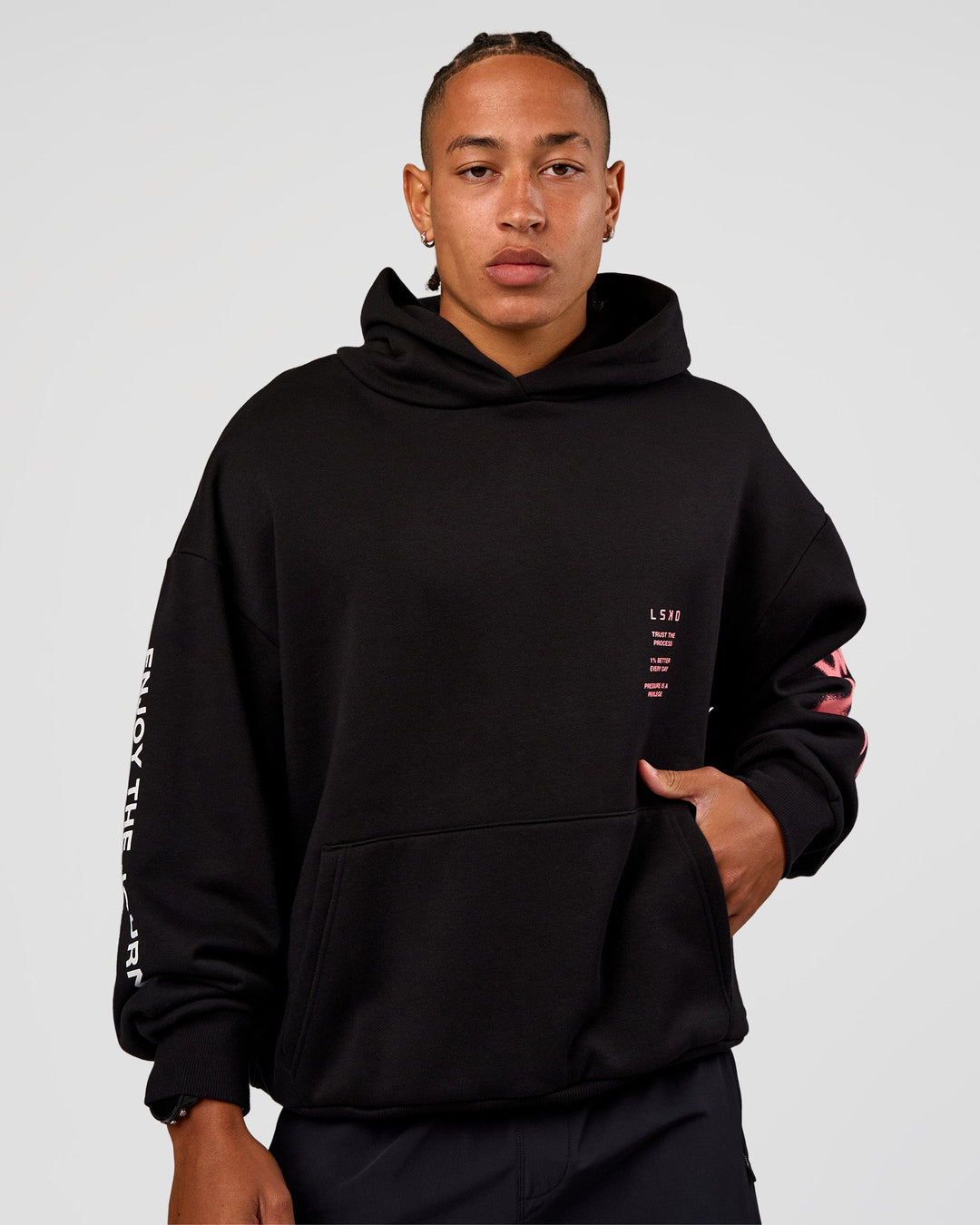 Man wearing CFT BNE 26 Unisex Oversized Hoodie - Black-Candy Pink | Model:Malebo | Size:M