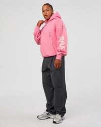 Man wearing CFT BNE 26 Unisex Oversized Hoodie - Candy Pink-Black | Model:Malebo | Size:M