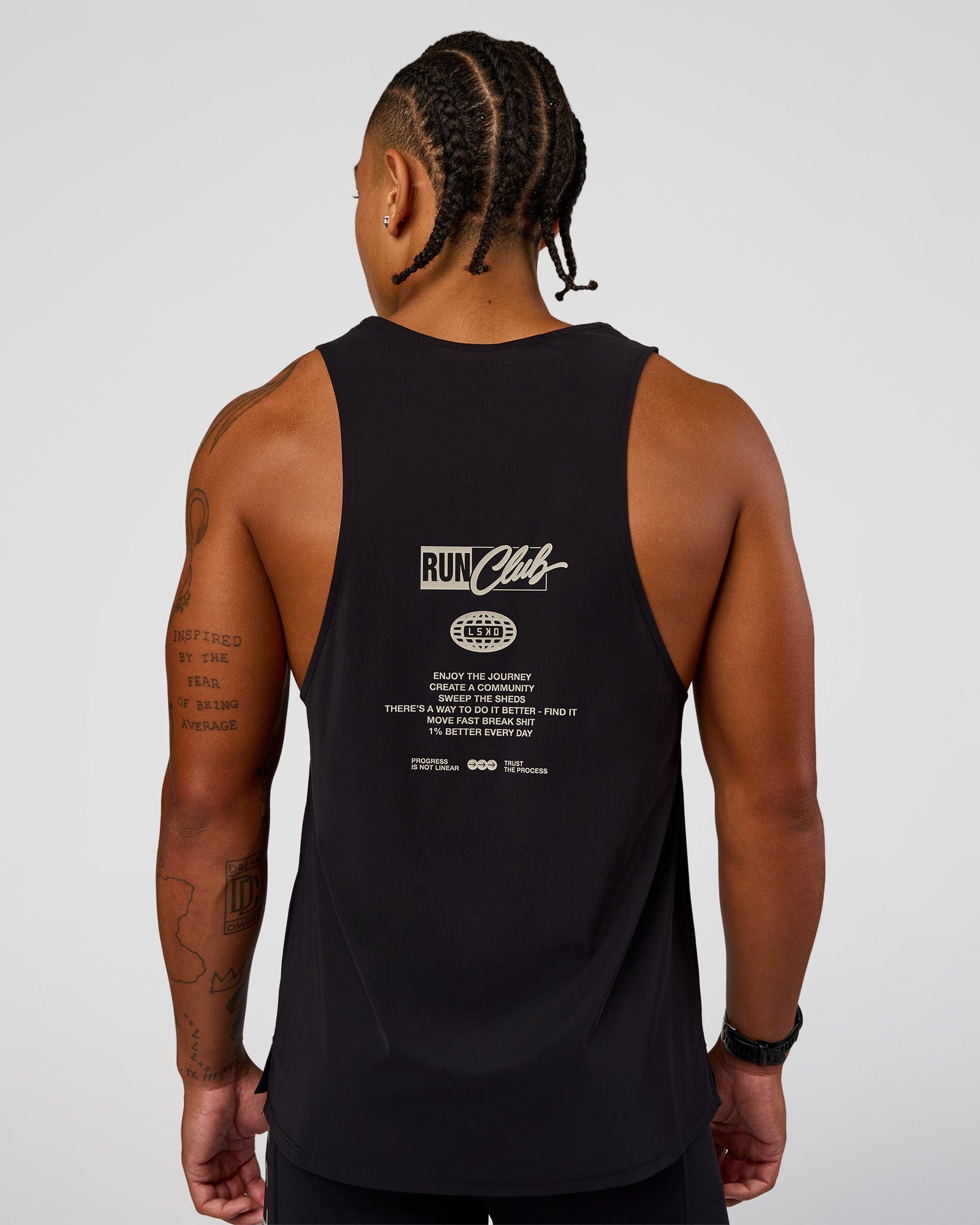 Man wearing Cadence Run Club Script Values Tank - Black-Alloy | Model:Malebo | Size:M