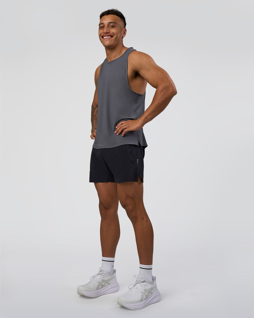 Man wearing Cadence Tank - Dark Storm | Model:Daarian | Size:M