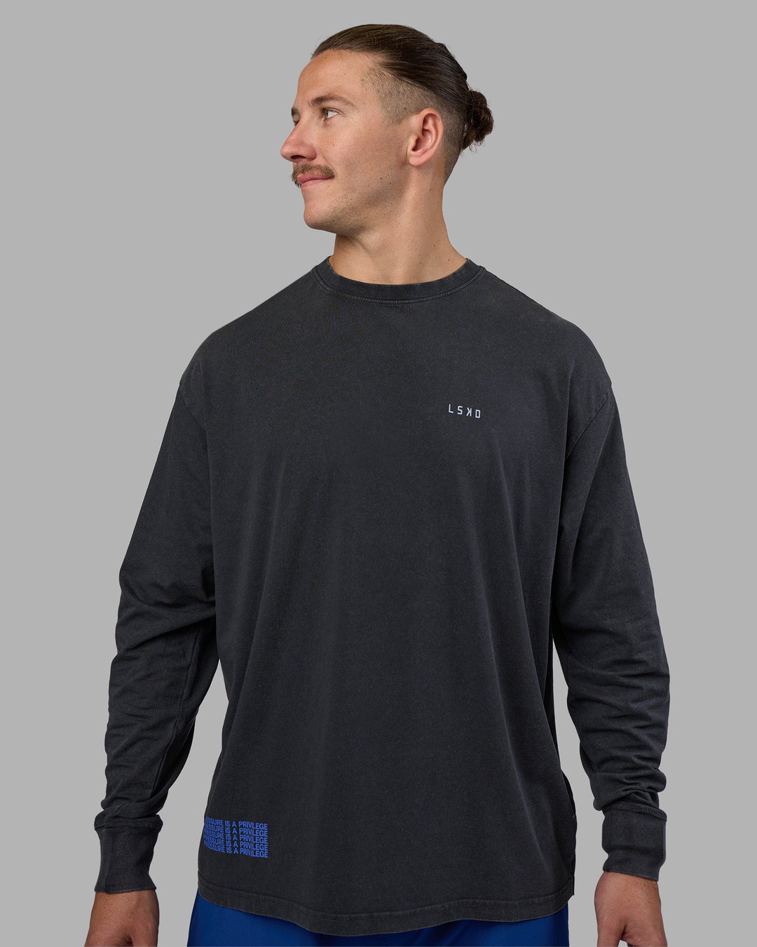 Man wearing Cali FLXCotton Oversized Long Sleeve Tee - Black Washed | Model:Jaiden | Size:M