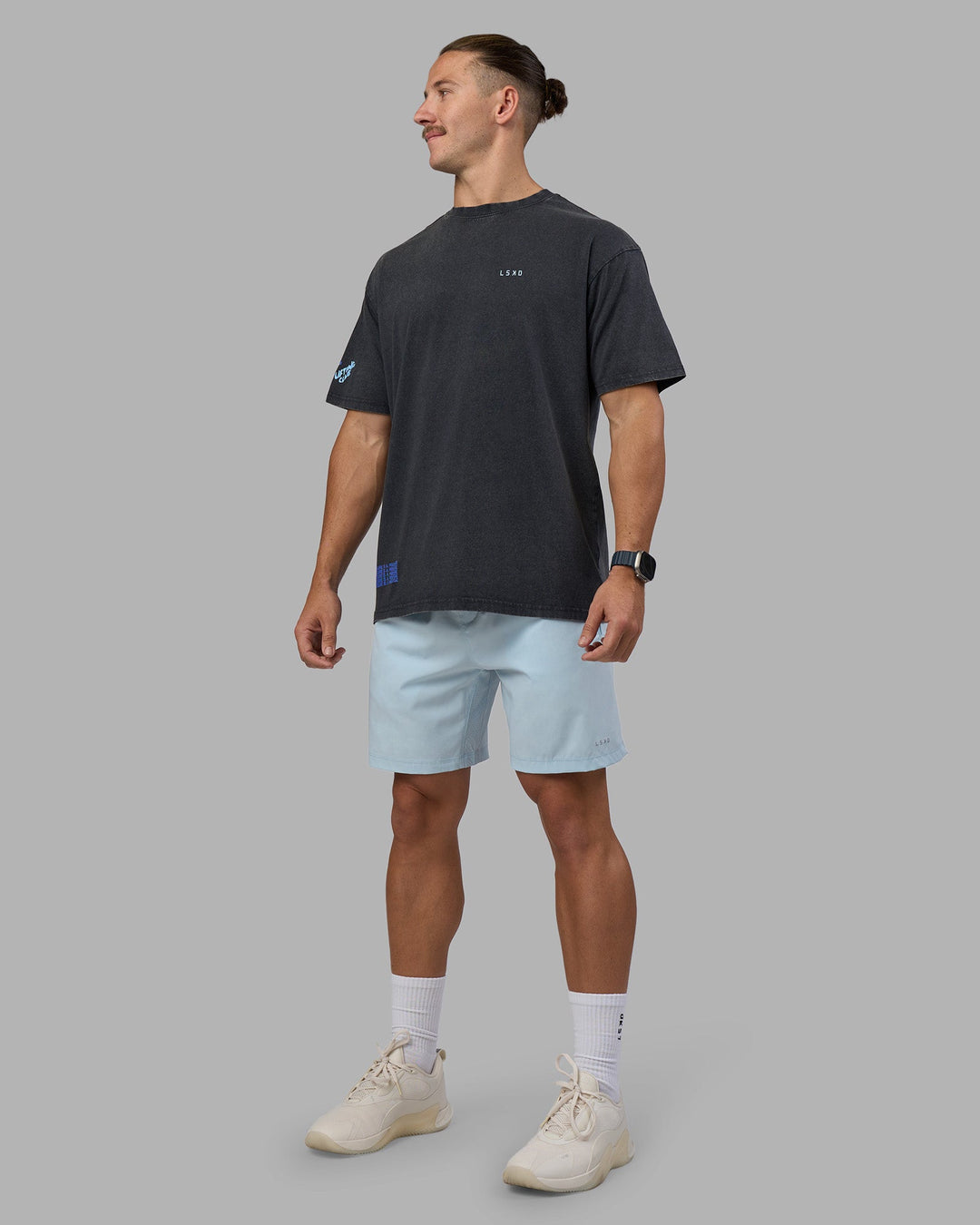 Man wearing Cali FLXCotton Oversized Tee - Black Washed | Model:Jaiden | Size:M