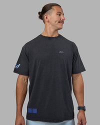 Man wearing Cali FLXCotton Oversized Tee - Black Washed | Model:Jaiden | Size:M