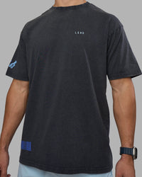 Man wearing Cali FLXCotton Oversized Tee - Black Washed | Model:Jaiden | Size:M