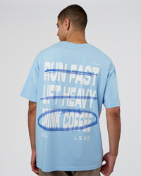 Man wearing Coffee Run FLXCotton Oversized Tee - Open Air-White | Model:Zoran | Size:M