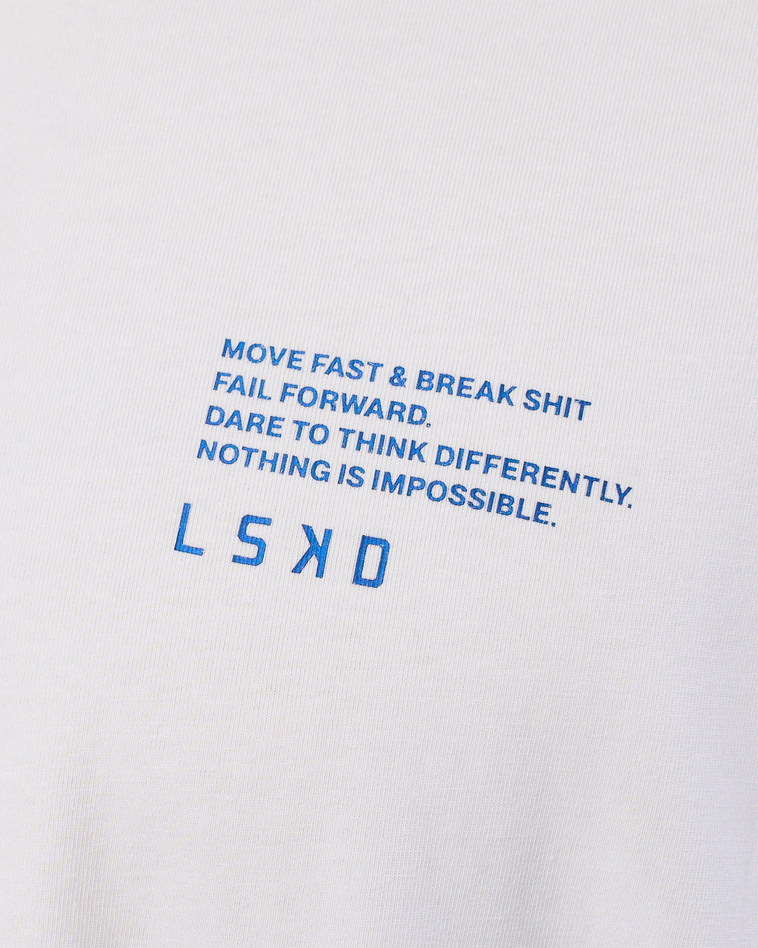 Man wearing Coffee Run FLXCotton Oversized Tee - White-Electric Indigo | Model:Zoran | Size:L