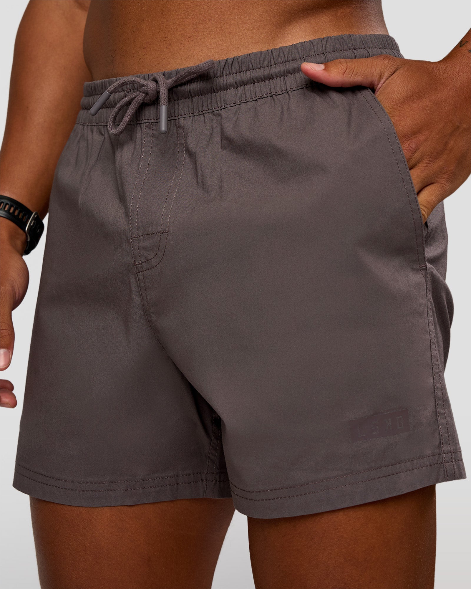 Man wearing Daily 5" Short - Duskstone | Model:Malebo | Size:M