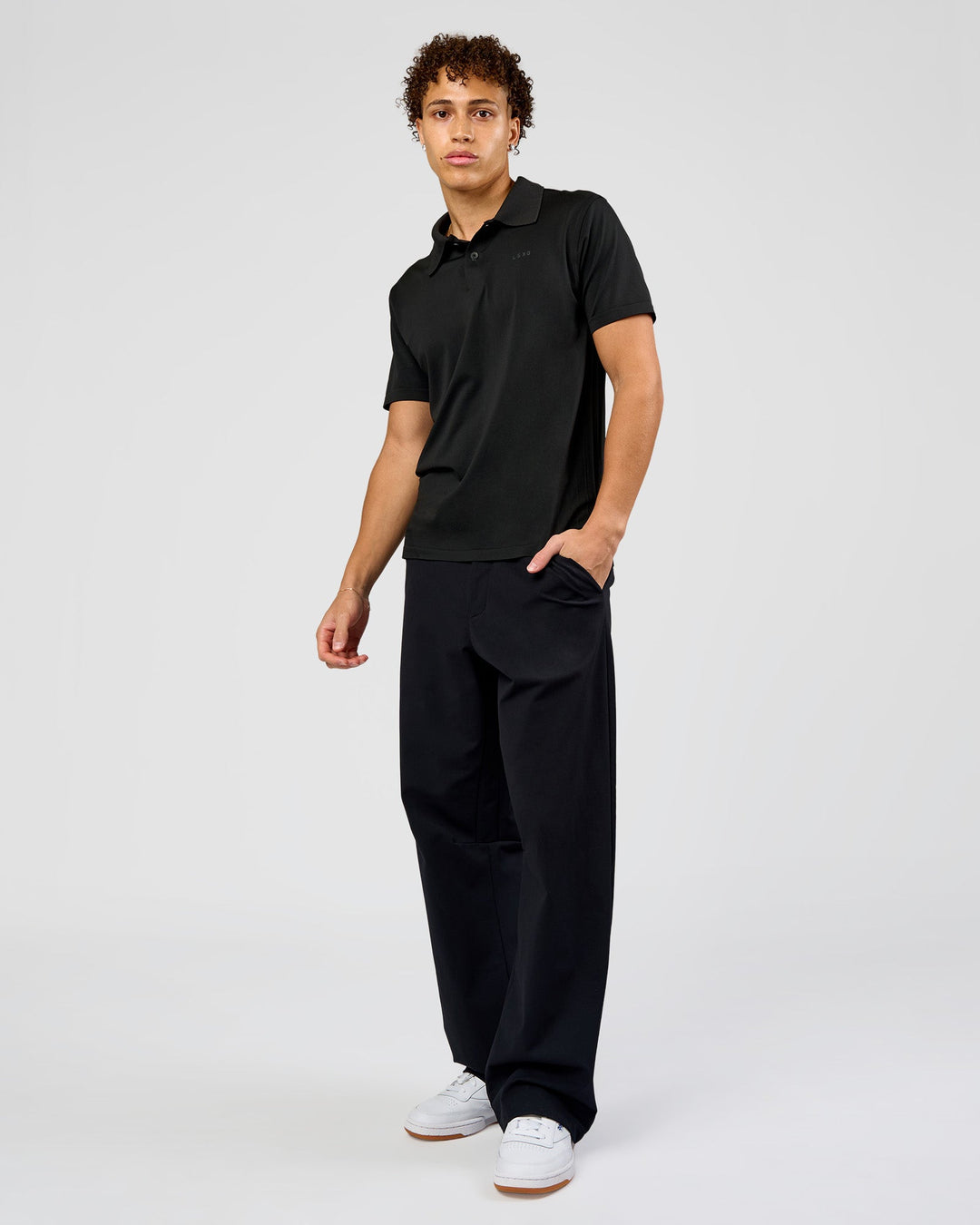 Man wearing Drive Seamless Polo - Black | Model:Leandro | Size:M - view 2