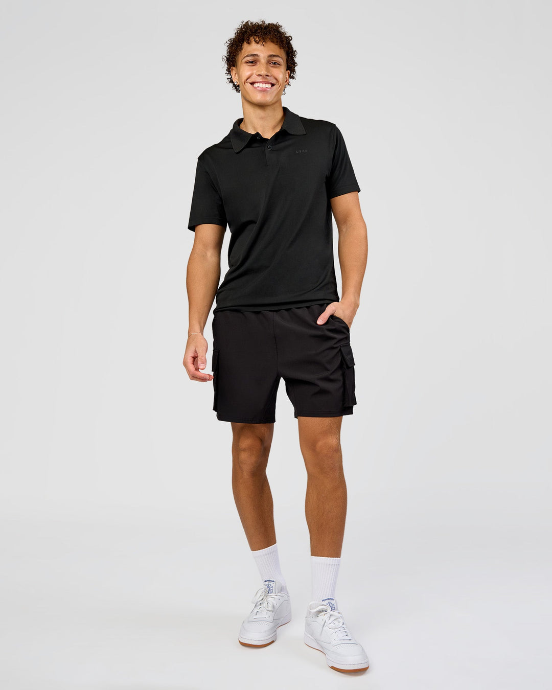 Man wearing Drive Seamless Polo - Black | Model:Leandro | Size:M - view 3