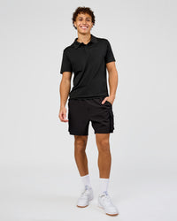 Man wearing Drive Seamless Polo - Black | Model:Leandro | Size:M | Thumbnail Index: 2