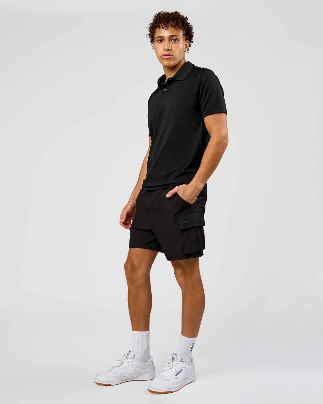 Man wearing Drive Seamless Polo - Black | Model:Leandro | Size:M - view 5