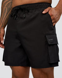 Man wearing Energy Stretch 6" Performance Cargo Short - Black | Model:Daarian | Size:M