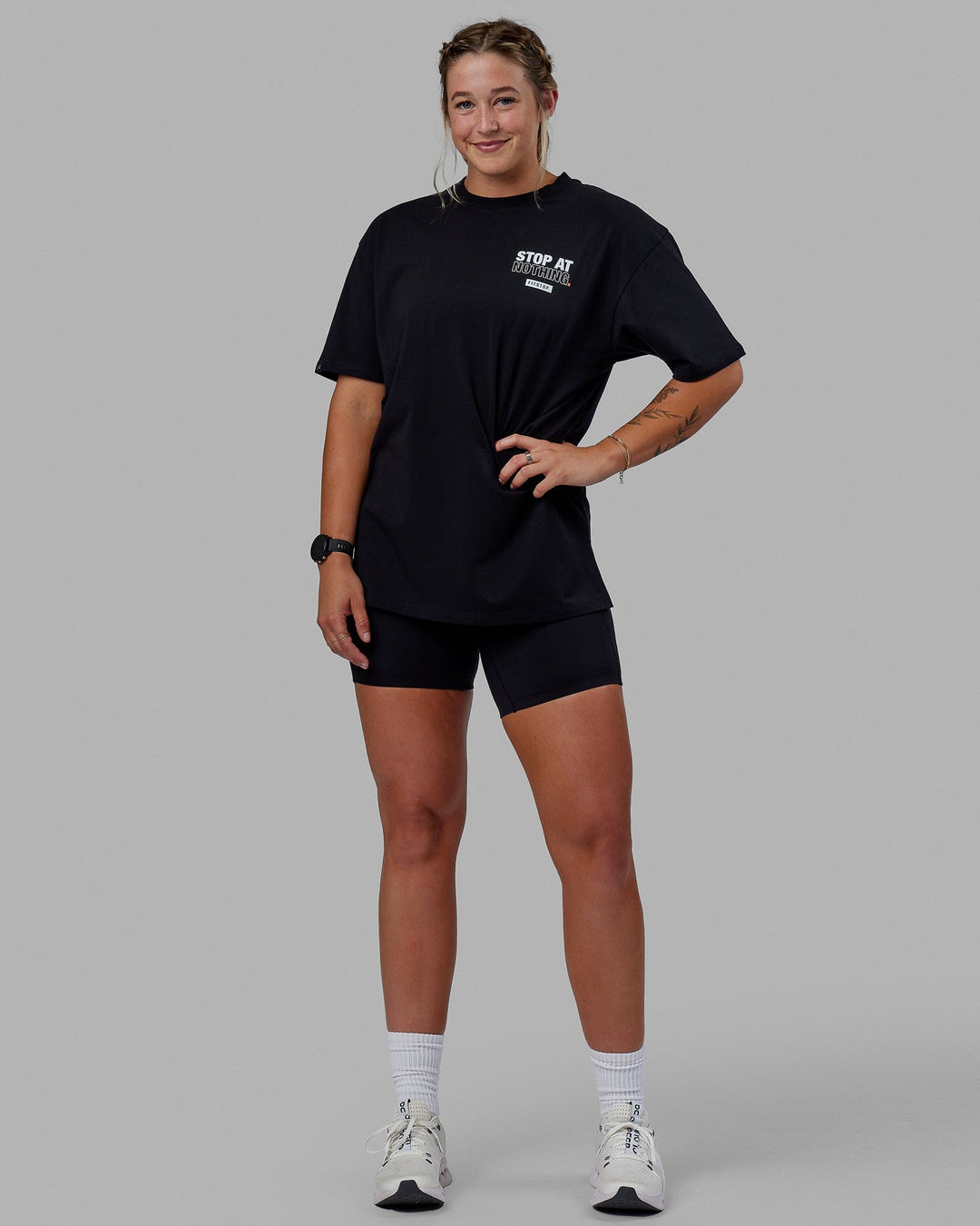 Woman wearing Unisex Fitstop Stop at Nothing Tee Oversize - Black-White