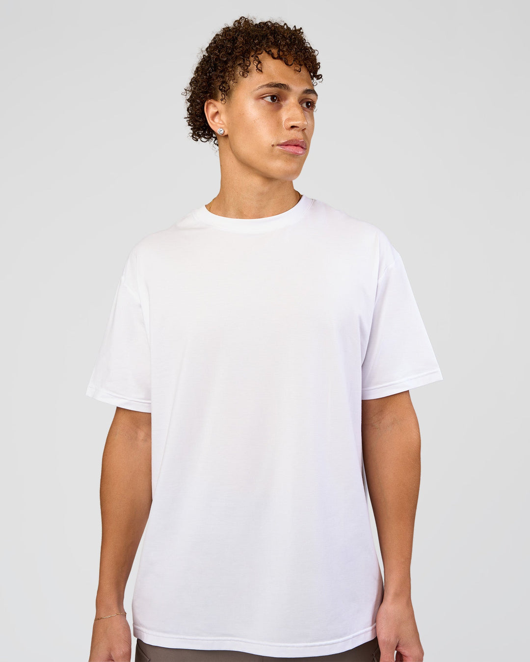 Man wearing Forever EffortlessTech Tee - White | Model:Leandro | Size:M - view 1