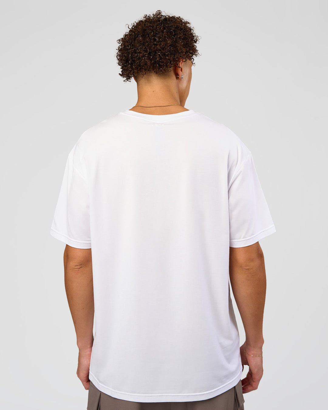 Man wearing Forever EffortlessTech Tee - White | Model:Leandro | Size:M - view 2
