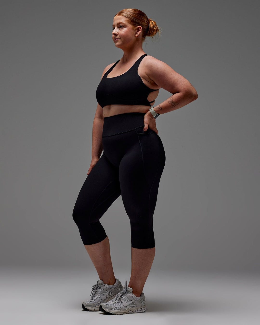 Woman wearing Fusion 3/4 Length Tight with Pockets in Black | Size:M