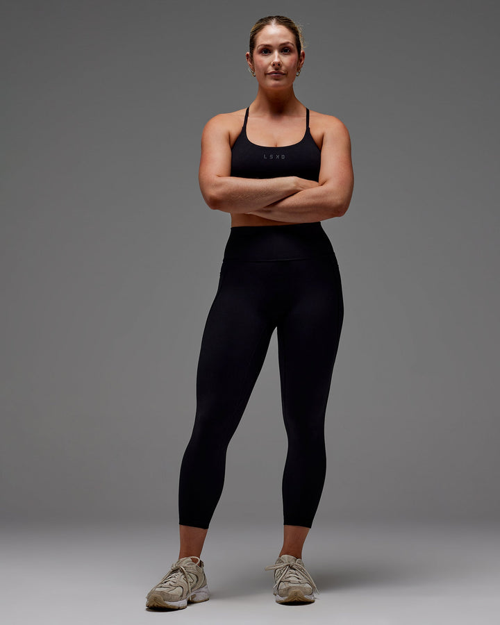 Woman wearing Fusion 7/8 Length Tight With Pockets in Black | Size:M
