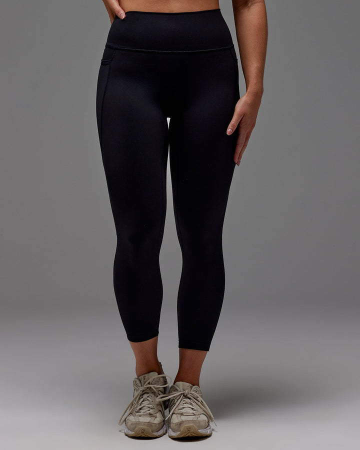 Woman wearing Fusion 7/8 Length Tight With Pockets in Black | Size:M
