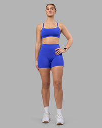 Woman wearing Fusion Ultra High-Rise 4" Short Pockets - Power Cobalt | Model:Amy | Size:M