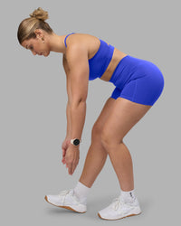 Woman wearing Fusion Ultra High-Rise 4" Short Pockets - Power Cobalt | Model:Amy | Size:M