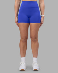 Woman wearing Fusion Ultra High-Rise 4" Short - Power Cobalt | Set:true | Angle:front | Model:Amy | Size:M