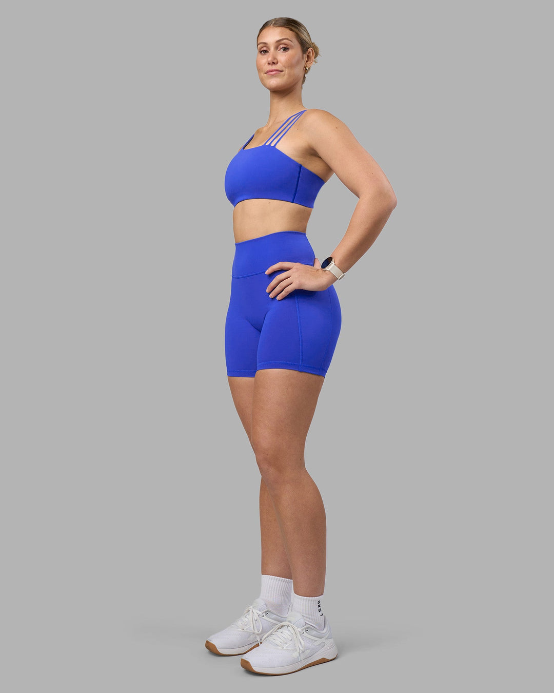 Woman wearing Fusion Ultra High-Rise 6&quot; Short Pockets - Power Cobalt | Model:Amy | Size:M