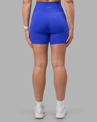 Woman wearing Fusion Ultra High-Rise 6" Short Pockets - Power Cobalt | Model:Amy | Size:M