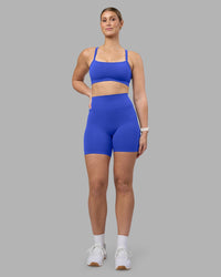 Woman wearing Fusion Ultra High-Rise 6" Short - Power Cobalt | Model:Amy | Size:M