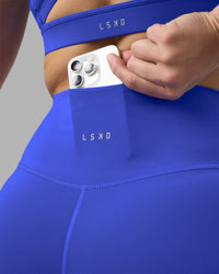 Woman wearing Fusion Ultra High-Rise 6" Short - Power Cobalt | Model:Amy | Size:M
