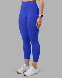 Woman wearing Fusion Ultra High-Rise 7/8 Legging Pockets - Power Cobalt | Model:Amy | Size:M