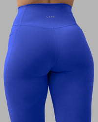 Woman wearing Fusion Ultra High-Rise Full Length Legging Pockets - Power Cobalt | Model:Amy | Size:M