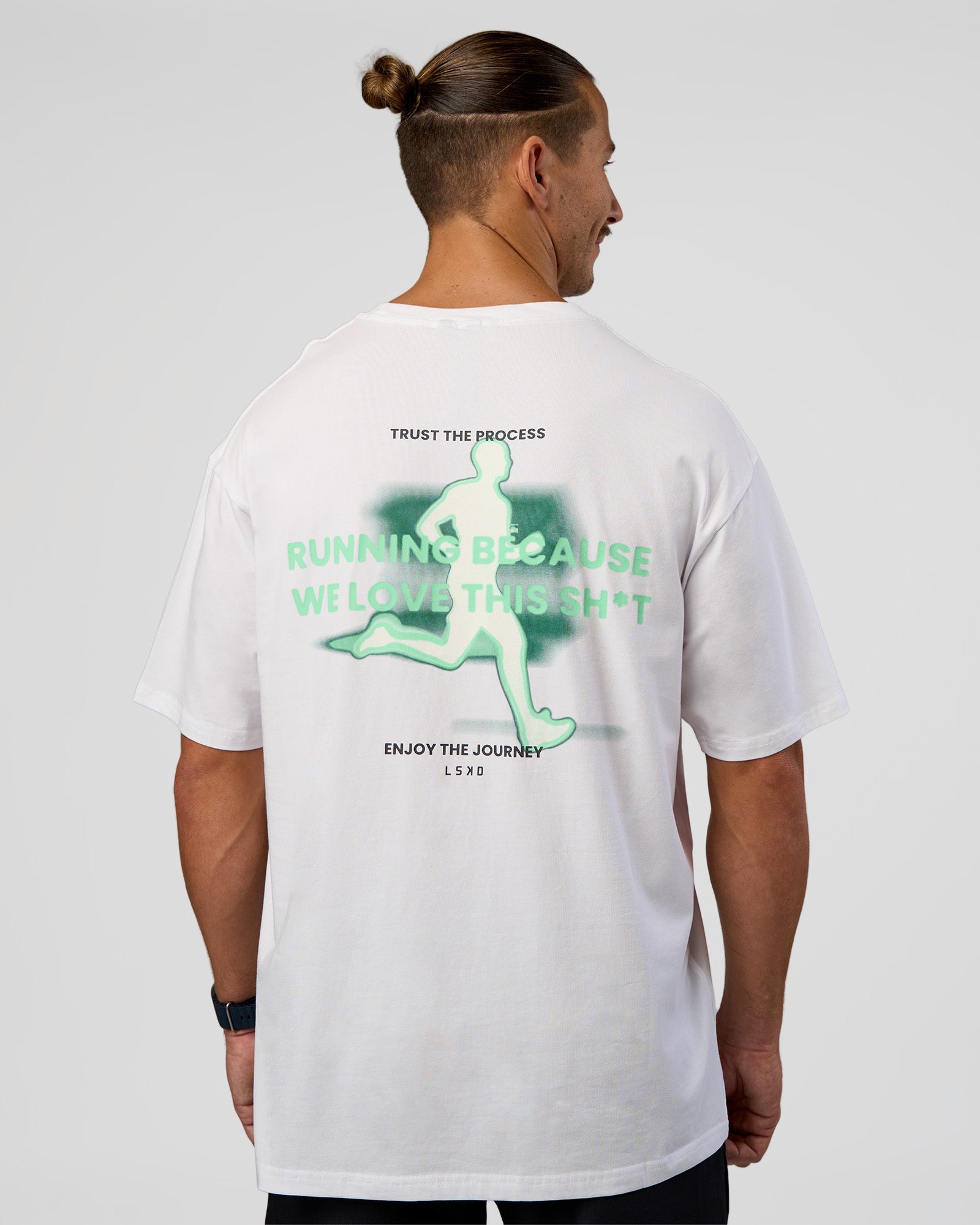 Man wearing High Run FLXCotton Oversized Tee - White-Jelly Mint | Model:Jaiden | Size:M