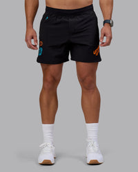 Man wearing Lift 6" Short - Black-Blue Atoll | Model:Jaiden | Size:M