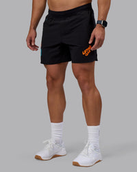 Man wearing Lift 6" Short - Black-Blue Atoll | Model:Jaiden | Size:M