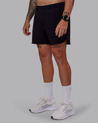 Man wearing Lift Lined 6" Short in Black-Reflective | Size:M